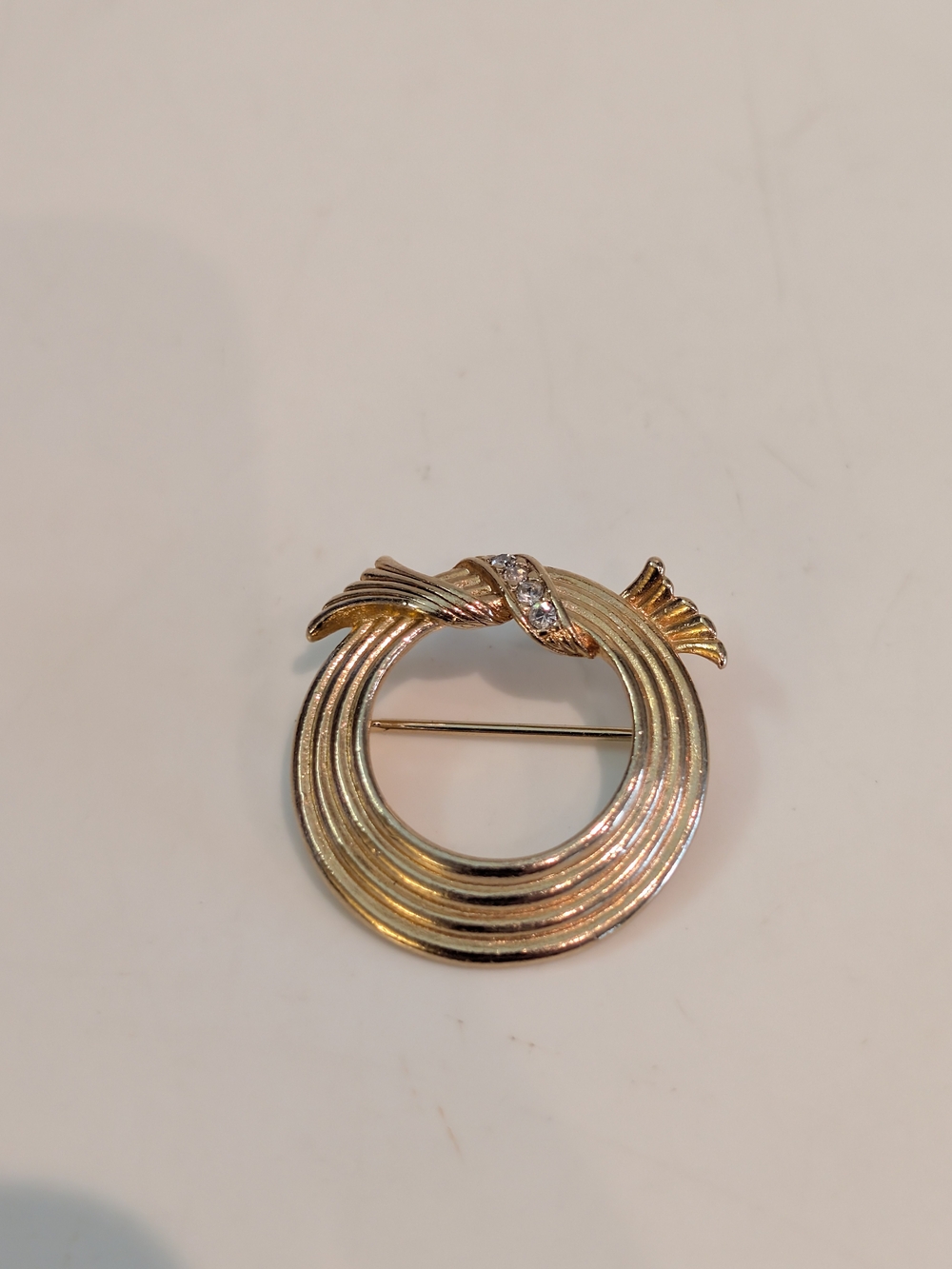 Vintage Jewelry Signed Avon Beautiful Gold Tone and Rhinestone Circular Knot Pin